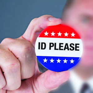 A badges displaying the phrase "ID PLEASE"